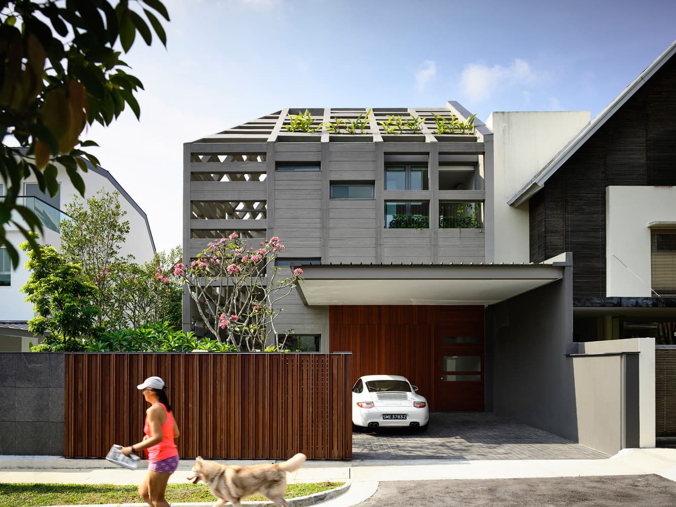Completed dark gabled landed house seen from the street
