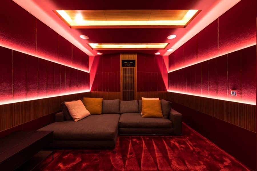 Home cinema room with red velvet acoustic panelling